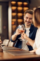 Smiling Couple Enjoying Drinks Together at a Cozy Restaurant Setting