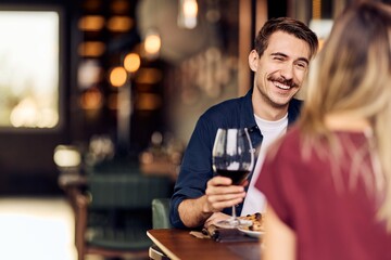 Happy Couple Enjoying a Dinner Date at a Cozy Restaurant