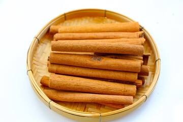 Dried cinnamon sticks arranged in a bundle.