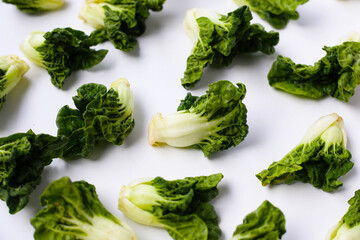 Fresh baby bok choy with crisp white green leaves.