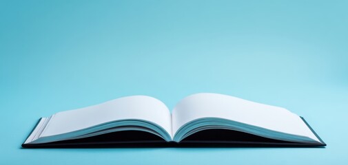 The blank open book invites creativity and inspiration with its empty pages.