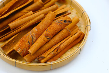 Dried cinnamon sticks arranged in a bundle.