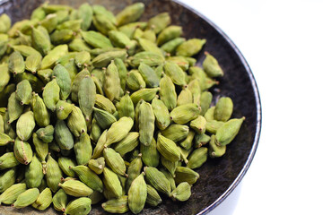 Green cardamom pods with aromatic and medicinal benefits.