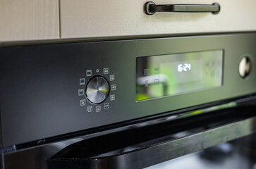 Modern kitchen has an oven and the control panel, oven control panel