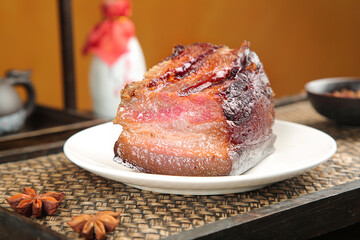 Thick Cut Smoked Bacon Slab on Rustic Farmhouse Kitchen Table with Woven Placemat