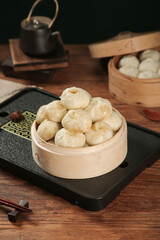 Traditional Chinese Xiaolongbao Soup Dumplings in Bamboo Steamer - Authentic Dim Sum Cuisine