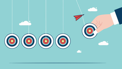 business target achievement as a milestone to achieve the next target, businessman pulling target board with bullseye arrow as e pendulum for milestone the next target