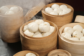 Traditional Chinese Xiaolongbao Soup Dumplings in Bamboo Steamers with Steam