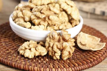 Large Delicious Paper-Skinned Xinjiang Walnuts in Bowl - Premium Healthy Nuts Food Photography