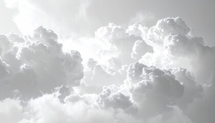 Fototapeta premium Ethereal, fluffy clouds fill the monochrome sky, creating a dreamy, abstract pattern of billowing white and gray. Light filters through