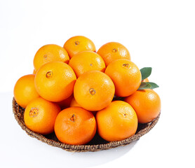Fresh Sweet Oranges in Wicker Basket on White Background