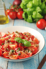 A bowl with Romanian tomato salad de Rosii	