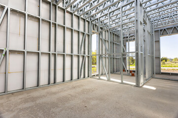 Light gauge steel framing system used for house construction. Wall to be clad with fibre cement board. Metal frame of newly built building. Construction of a new tiny house