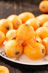 Fresh Yunnan Loquat Star Fruit on White Plate - Golden Alpine Five-Star Fruit Display