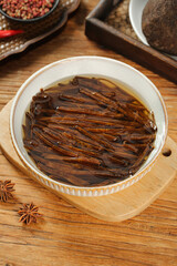 Homemade soy sauce dish with shredded cabbage on wooden board - traditional downhome cooking ingredients and spices