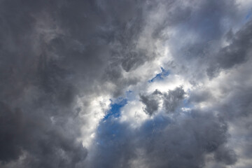 The sky is cloudy and the sun is shining through the clouds