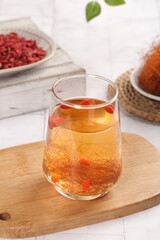 Herbal Wellness Tea with Corn Silk and Goji Berries - Natural Health Drink in Glass Cup