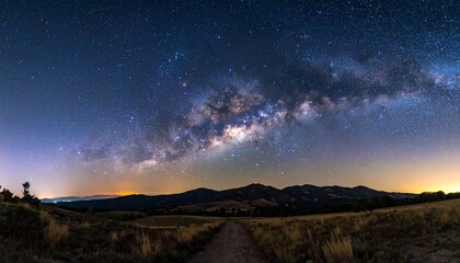 Stunning natural night landscape with a clear starry sky, silhouetted trees, and soft moonlight filtering through the clouds