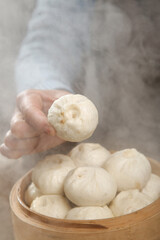 Traditional Xiaolongbao Soup Dumplings with Meat Filling in Bamboo Steamer - Chinese Cuisine