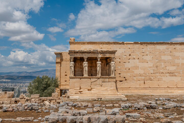 Fototapeta premium Erechtheion Temple Caryatids Porch At Acropolis Athens Greece. Ancient Greek architecture, marble maidens, ionic columns, archaeological site