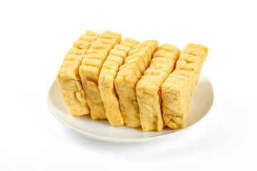 Sliced Golden Tempeh Tofu Protein Food on White Plate Vegetarian Ingredient