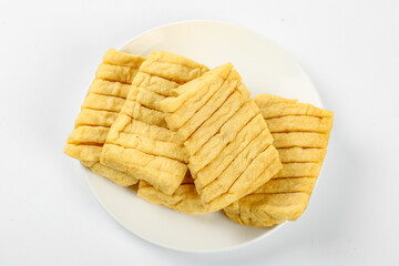 Dried Tofu Slices Henan Style Traditional Asian Soy Protein Snack Food on White Plate