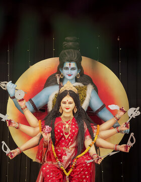 Shiv Parvati idol in divine form, Hindu goddess Durga with Shiva statue, Traditional Navratri festival decoration, Artistic sculpture of Shiv and Shakti stock photo.