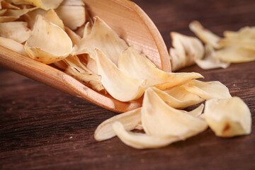 Fresh and Dried Chinese Lily Herbs Tonic Ingredients on Wooden Spoon
