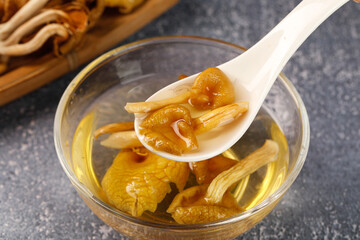 Yunnan Golden Dried Mushrooms Soaking in Bowl - Traditional Chinese Cooking Ingredient Preparation