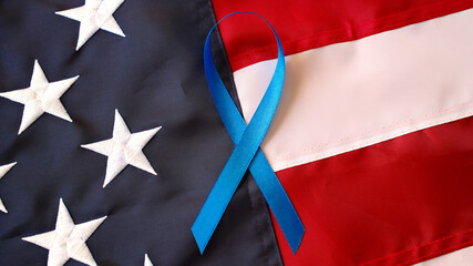Colon Cancer Awareness Month dark blue ribbon on American flag