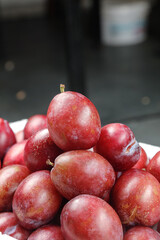 Fresh Red Plums at Market Display - Ripe Stone Fruit Ready for Sale