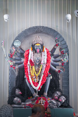 Kali maa idol statue, Hindu goddess Kali murti, Divine maa Kali sculpture, Powerful goddess Kali worship stock photo.