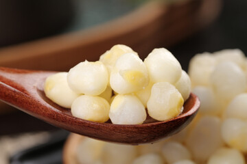 Freshly Peeled White Corn Kernels on Wooden Spoon - Raw Breakfast Ingredient