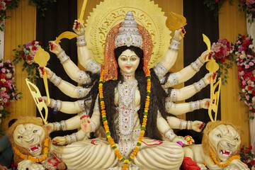 Goddess Durga with lion statue, Hindu goddess Durga idol, Navratri festival Durga maa, Divine Durga mata sculpture stock photo.