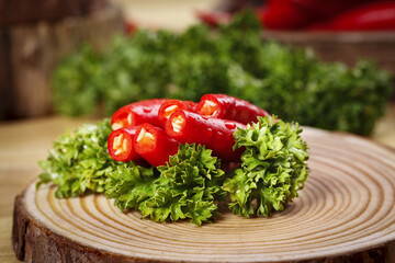 Fresh Red Sichuan Chaotian Peppers with Parsley on Wooden Board - Chinese Cooking Ingredients