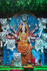 Goddess Durga with lion statue, Hindu goddess Durga idol, Navratri festival Durga maa, Divine Durga mata sculpture stock photo.