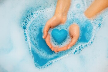 Fototapeta premium Heart shaped blue bath bomb in foam water
