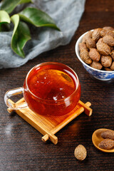 Chinese Herbal Tea with Nuts Traditional Medicine Health Drink on Wooden Table