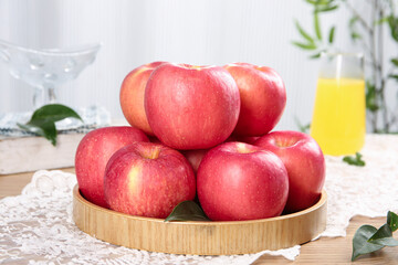 Fresh Red Fuji Apples from Luochuan Display on Wooden Plate in Kitchen Setting