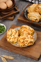 Handmade Scallion Pancake Rolls with Meat Filling on Wooden Board - Traditional Asian Food Preparation