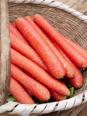 Fresh Orange Carrots in Wicker Basket - Healthy Organic Vegetables