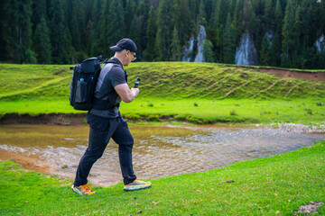Hiker filming Ponor creek sinkholes