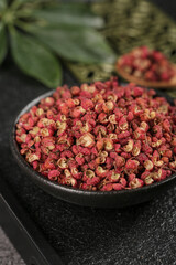 Sichuan Peppercorns in Traditional Mortar - Chinese Spice Granules for Authentic Asian Cooking