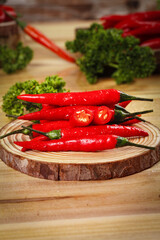 Fresh Red Chili Peppers on Wooden Board - Spicy Cooking Ingredients