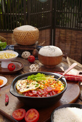 Asian Rice Casserole with Vegetables and Steamed Rice on Wooden Table