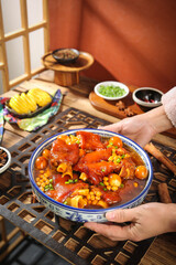 Asian Pork Knuckle Stew with Corn and Soybeans in Traditional Bowl