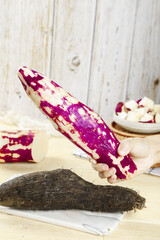 Fresh Purple Sweet Potatoes Heart-Shaped Yam on White Wooden Farm Kitchen Background