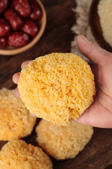 Fresh White Tremella Fungus Mushroom in Hand - Golden Ear Mushroom Ingredient for Asian Cooking