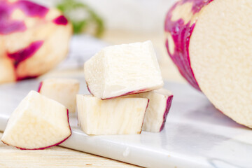 Fresh Purple White Radish Turnip Cubes Cut on Cutting Board Healthy Root Vegetable Cooking Ingredient