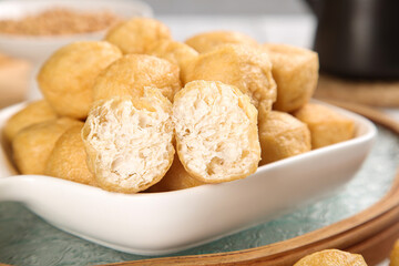 Golden Fried Tofu Puffs in White Bowl - Crispy Asian Vegetarian Food